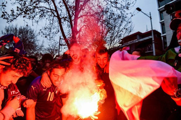 Italian soccer fans celebrate in Lygon Street, Carlton, after Italy won the Euro 2020 final against England at Wembley Stadium in London. 
