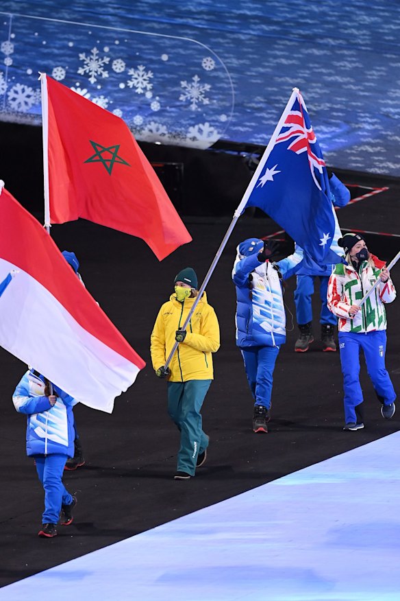 Australian flagbearer Sami Kennedy-Sim during the Beijing 2022 Winter Olympics closing ceremony on Sunday night.