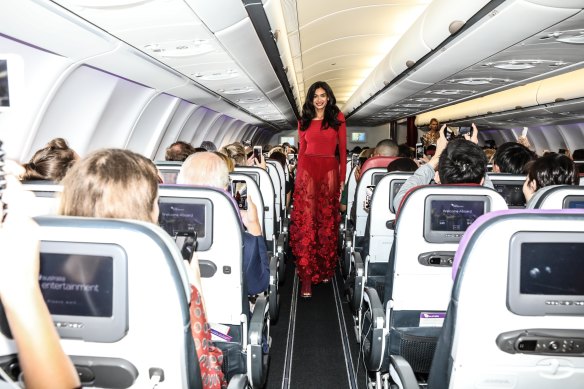 Kelly Gale opens the Runway in the Sky show on board a Virgin Australia plane featuring designs by Australian brand Ginger and Smart.