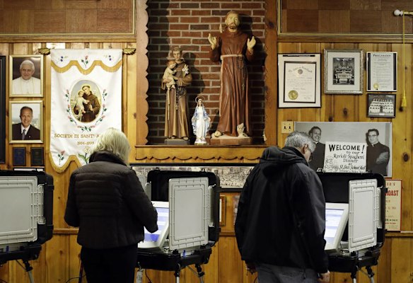 Voters cast their ballots at a polling place inside St. Leo's Catholic Church in Baltimore on Election Day.