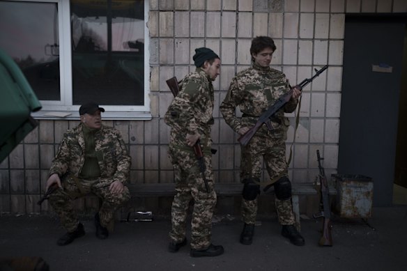 Civilian volunteers attend a training camp of the Ukrainian Territorial Defense Forces in an area northeast of Kyiv.
