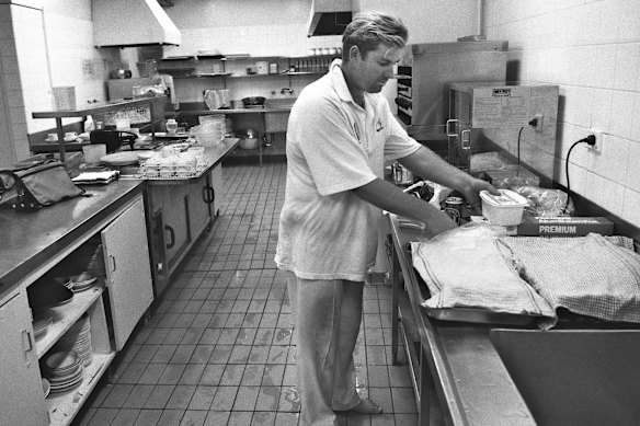 Warne makes a cheese sandwich during the third Test against the West Indies at the MCG in December 1996.