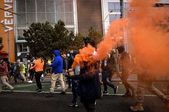 Flares let off at a  protest against outisde the CFMEU union office.
