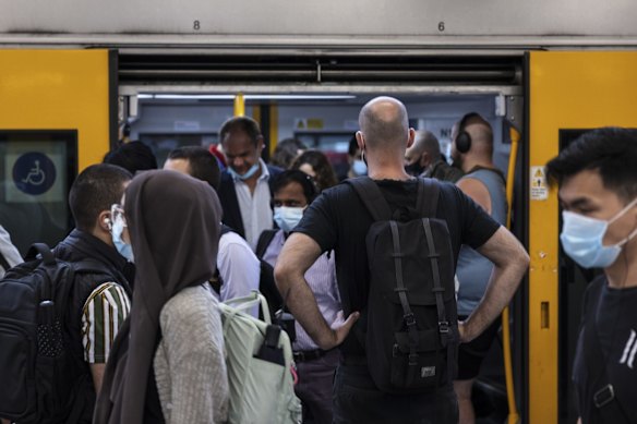 Early morning commuters at Central Station. Many trains were packed on arrival on Tuesday, making social distancing impossible.