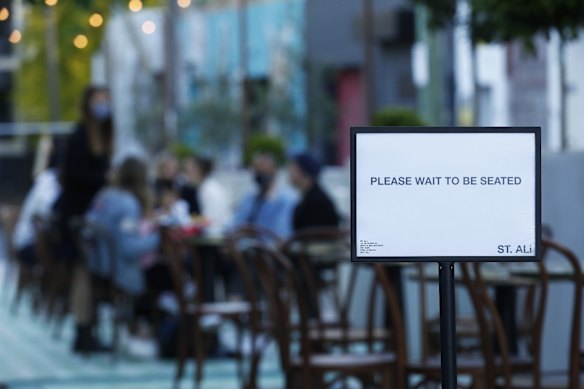 People are seen dining outside St. Ali Cafe in South Melbourne on October 28, 2020 in Melbourne, Australia. 