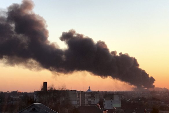 A cloud of smoke raises after an explosion in Lviv, western Ukraine. The mayor of Lviv says missiles struck near the city's airport early on Friday.