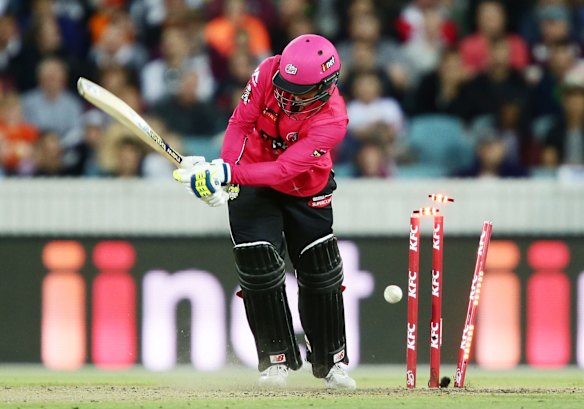 Nic Maddinson of the Sixers is bowled by Yasir Arafat of the Warriors.