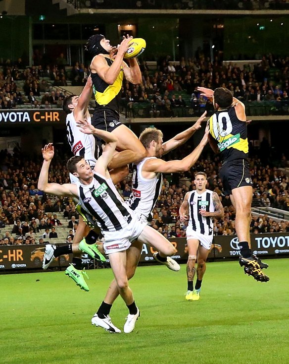 Ben Griffiths of the Tigers takes a mark during the round two AFL match between the Richmond Tigers and the Collingwood Magpies.
