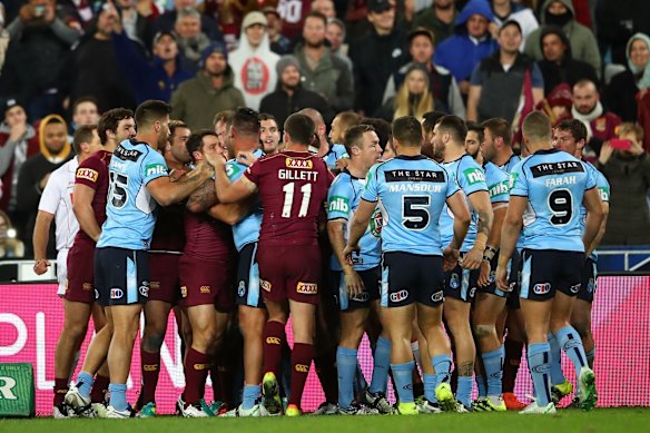 Players from both teams wrestle.