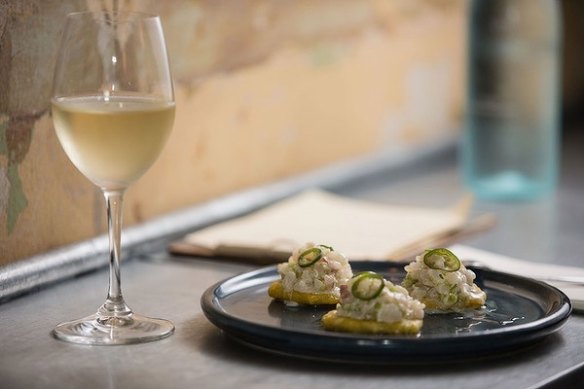 The Gretz's seafood-fixated menu includes tostones with raw snapper and pique (pineapple vinegar) on plantain.