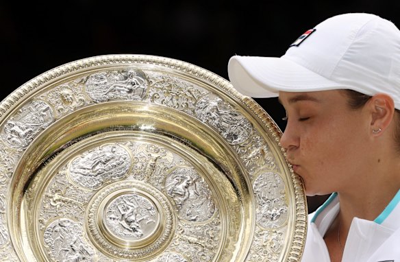 Summit reached and a lifelong dream fulfilled. Barty kisses the women's Wimbledon Open trophy last year.