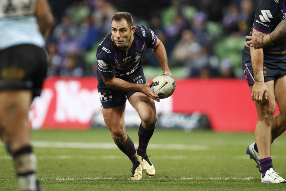 Cameron Smith of the Storm passes the ball during the Round 17 NRL match between the Melbourne Storm.