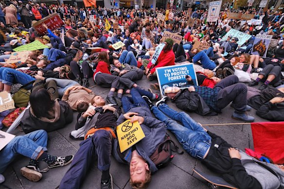 Protesters take part in the Climate Emergency XR Snap Rally in Melbourne.