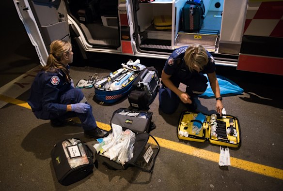 2:55am. NSW Ambulance Paramedics restock their medical kits at St Vincent's Hospital after a job.
