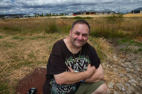 Hilbert resident Benny Rees in front of the “living stream” promised by developer Peet.