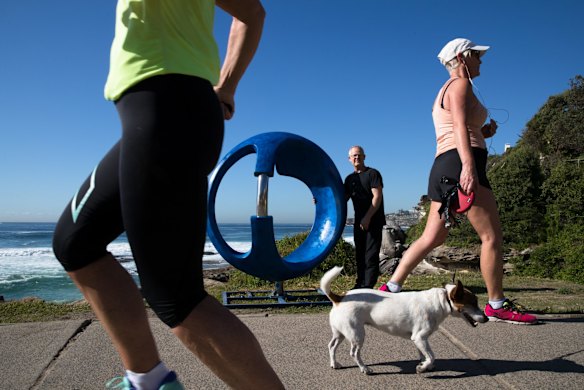 Tim MacFarlane Reid, installing his work, 'Grace', at Sculpture by the Sea, in Sydney. 
