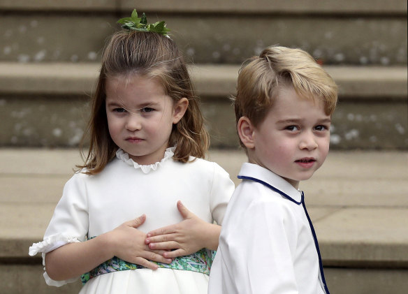 Prince George and Princess Charlotte arrive for the royal wedding.
