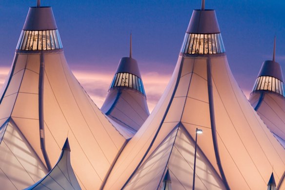 JEPPESEN TERMINAL, DENVER: Denver airport's Jeppesen Terminal features pitched roofs that recall the peaks of the surrounding Rocky Mountains, or perhaps early settler wagons or native tepees – and they certainly prove airports don't have to be boring. The tent-like roofs are made from wafer-thin fibreglass coated with Teflon, thin enough to let in light. The terminal is often cited as having one of the best architectural designs of any American building.