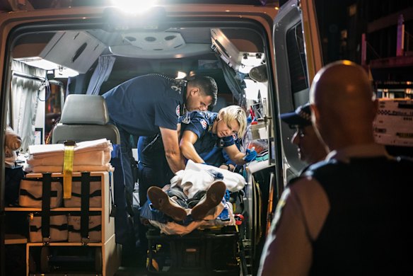 2:14am. NSW Ambulance Paramedics and Police officers perform CPR on a 40 year old male who collapsed with a cardiac arrest at Easts Leagues Club. He was then transported to St Vincent's Hospital. 