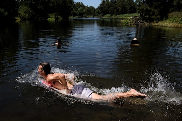 Locals swim in the Nepean River at Castlereagh as temperatures are forecasted to reach over 40 degrees in Sydney's west today.