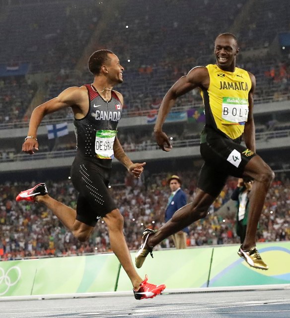 Catch me if you can: Usain Bolt pulls ahead of Andre De Grasse in Rio.