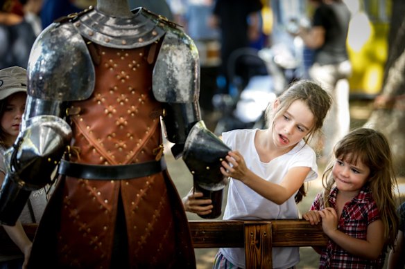 Emme, 8, and sister Georgie, 5, with Sam Bloomfield sculpture.