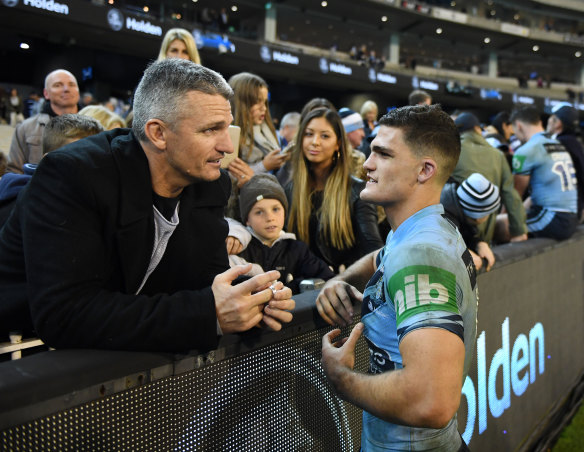 Family affair: Nathan Cleary speaks to his father Ivan after his Origin debut.