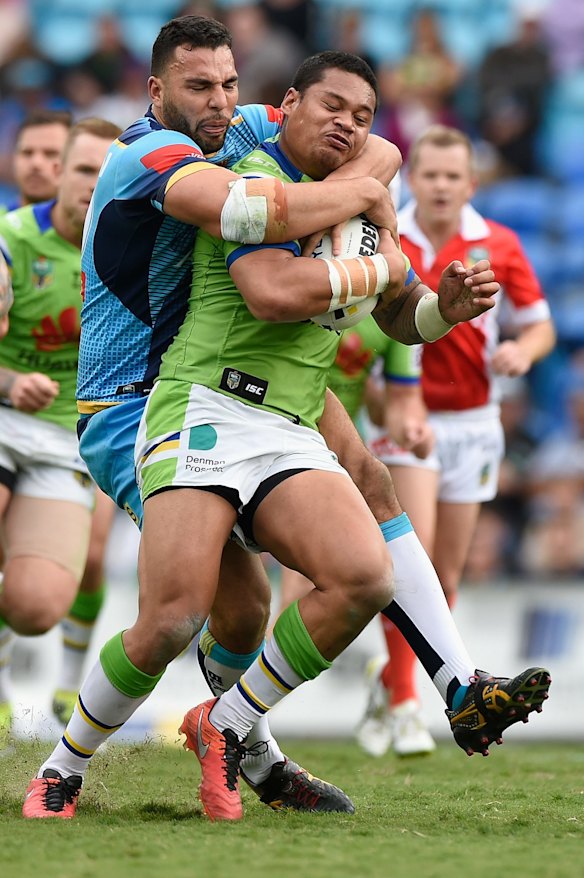 Joseph Leilua of the Raiders is tackled.