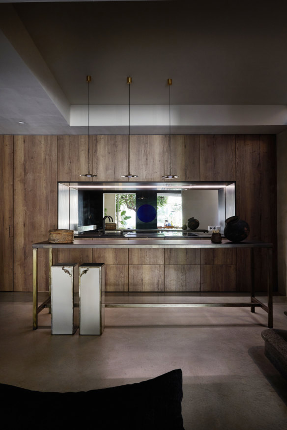 “The kitchen cabinetry hides a secret door into a bedroom, and the island was built by a local metal worker,” says Chard. Stools are by Spanish studio Kikekeller.