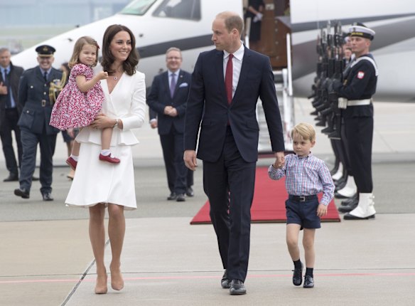 July 17- The Duchess stunned in a signature white Alexander McQueen peplum silk coat. She also gave a subtle nod to Poland's national colours with her red Jenny Packham clutch and new jewellery. The diamond ring, necklace and earring had subtle ruby gemstones.