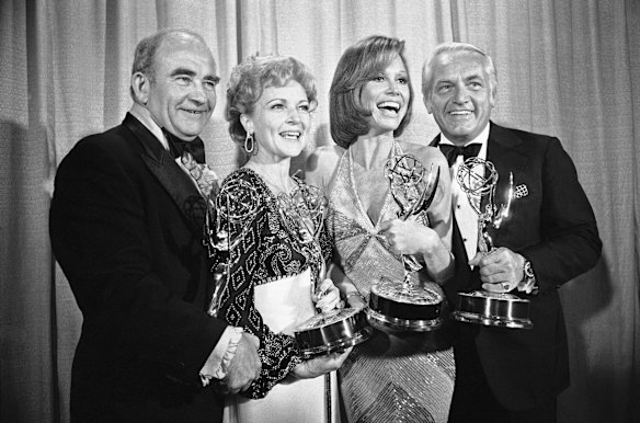 In this May 18, 1976 file photo, cast members of the "Mary Tyler Moore Show," pose with their Emmys backstage, at the 28th annual Emmy Awards in Los Angeles. From left are, Ed Asner, Betty White, Mary Tyler Moore and Ted Knight.  