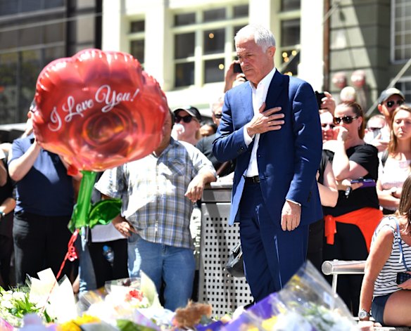 Malcolm Turnbull lays flowers at a Bourke Street memorial.