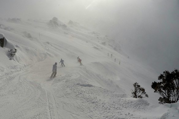 All down hill from here as skiers make their way through the snowfall.