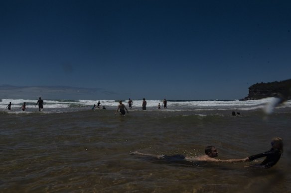 Swimmers at Avalon Beach in Sydney. Northern beaches are preparing for an influx of visitors when lockdown ends.