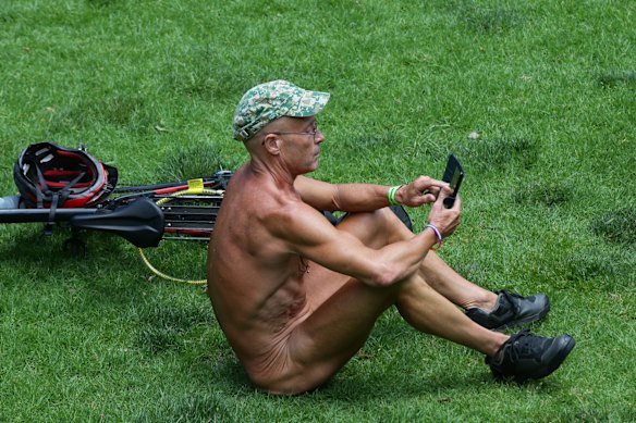 A cyclist takes a break during the 2021 Naked Bike Ride on December 5, 2021 in Melbourne, Australia.