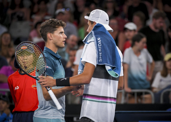 Dominic Thiem (left) couldn't continue through the third set.