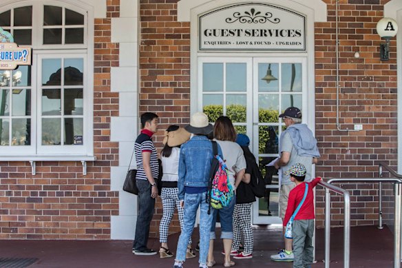 A family from Singapore on holiday on the Gold Coast arrive to closed doors at Dreamworld where four people died after a malfunction with the 'Thunder River Rapids' at the theme park.