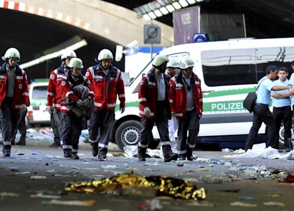 Emergency services personal at the scene where panic broke out during the Love Parade in Duisburg, western Germany. 