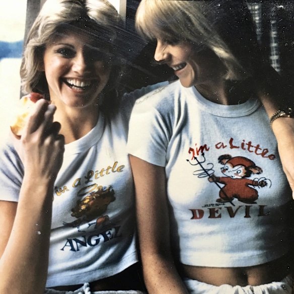 Olivia (left) and Fleur wearing angel and devil T-shirts in the 1970s.