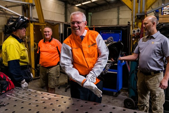 Welding for the cameras at a visit to Opie Manufacturing in Emu Plains. He burnt his finger during the “photo opportunity”.