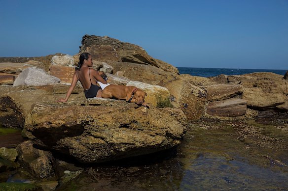 Dawn Aitoa of Randwick cools off with her dogs at Coogee Beach as the heatwave set to get worse in the coming days.