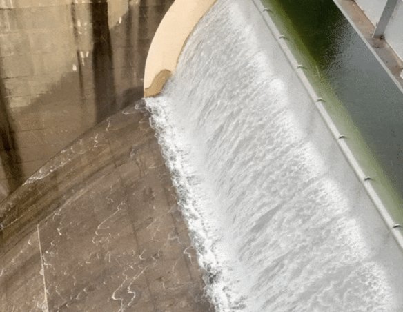 Warragamba Dam spills during the March floods. The Berejiklian government is expected to release the long-awaited environmental impact statement into the dam wall plan.