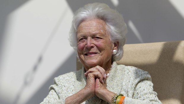 Former first lady Barbara Bush listens to a patient's question during a visit to the Barbara Bush Children's Hospital in Portland, Maine, in 2013.
