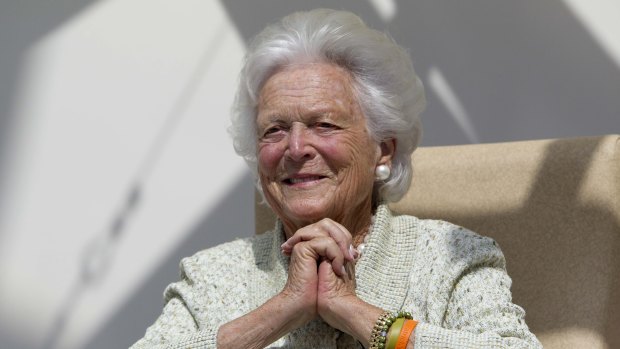 Former first lady Barbara Bush listens to a patient's question during a visit to the Barbara Bush Children's Hospital in Portland, Maine, in 2013.