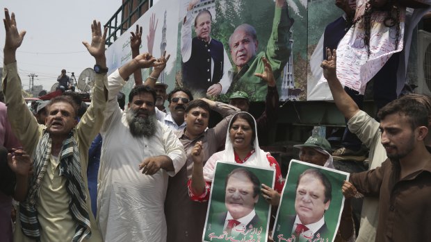 Supporters of Pakistani former prime minister Nawaz Sharif chant slogans for their leader in Lahore on Friday.