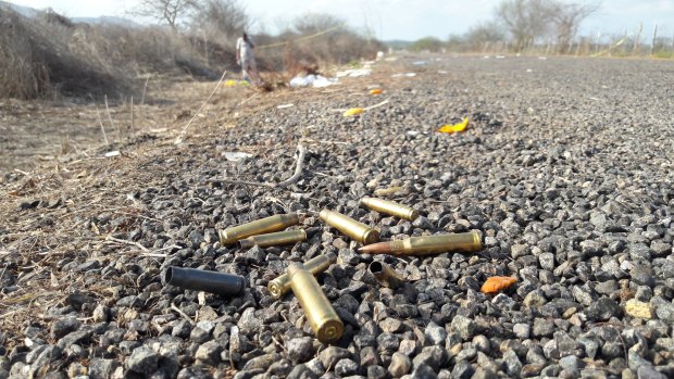 Spent bullet casing litter a road after authorities reported a gun battle with armed men in the gang-plagued north-western state of Sinaloa, where homicides have spiked dramatically following EL Chapo's extradition.