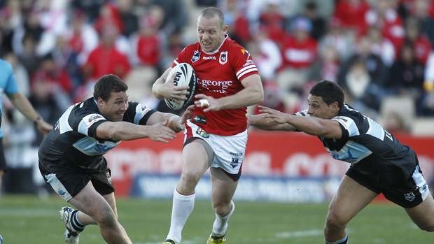 Derby flashback: Ben Hornby makes a break for the Dragons in their victory over Cronulla in Wollongong in 2012.
