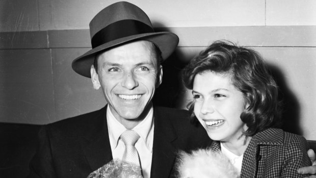 Frank Sinatra, and daughter, Nancy Sinatra, arrive at Sydney Airport in January 1955.