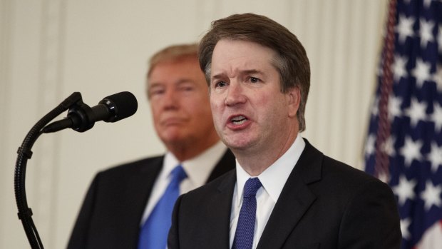 US President Donald Trump listens as Brett Kavanaugh, his Supreme Court nominee, speaks during an event in the East Room of the White House, Monday.