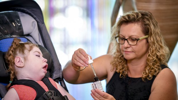 Five-year-old Gemma, who is critically ill, received an early dose of medical cannabis thanks to the Victorian government. This picture was taken at a news conference featuring Premier Daniel Andrews in March 2017.